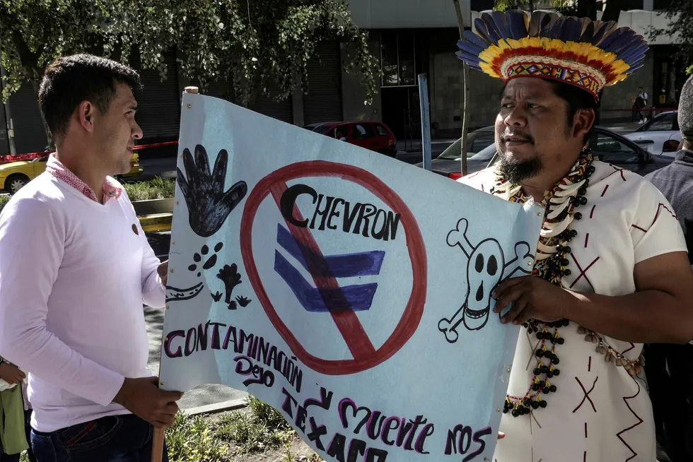 Chevron court win: Ecuadoran indigenous protest along with relatives outside the General Attorney's office in Quito in September 2018
