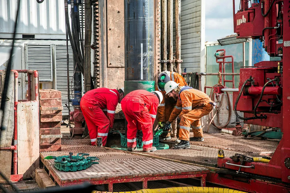 Making progress: workers connect sections of pipe last month on the drilling platform at Cuadrilla Resources' Preston New Road pilot gas well site near Blackpool, UK