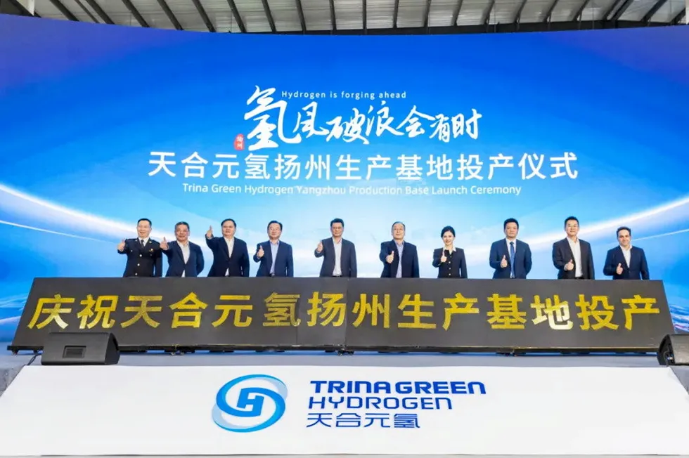 Officials give the thumbs up at the launch of the 1GW production line at Trina Green Hydrogen's Yangzhou production base.