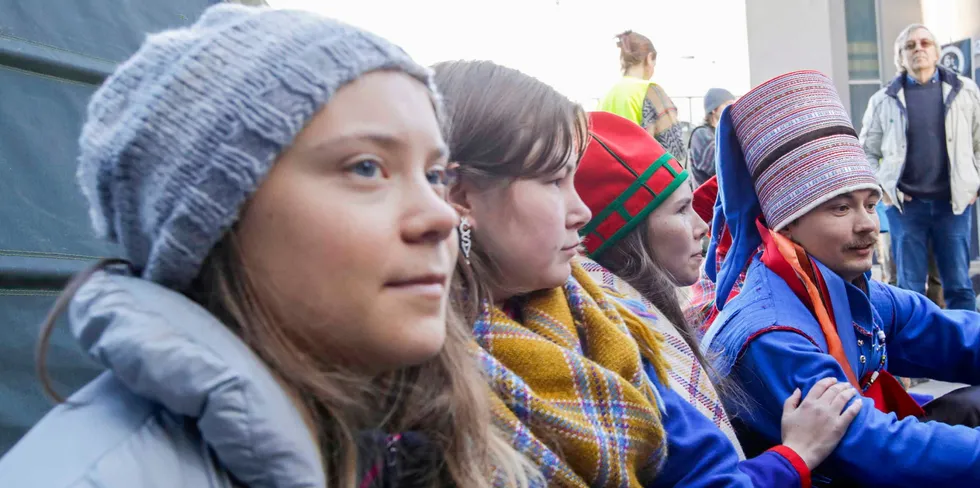 Swedish environmental activist Greta Thunberg (L) demonstrates outside the seat of the Statkraft energy company in Oslo, Norway, on October 12.
