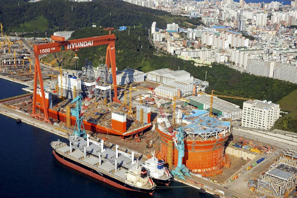 Busy times: the cylindrical Goliat FPSO and and Dockwise heavy transport vessel Vanguard at Hyundai Heavy Industries offshore yard in 2013