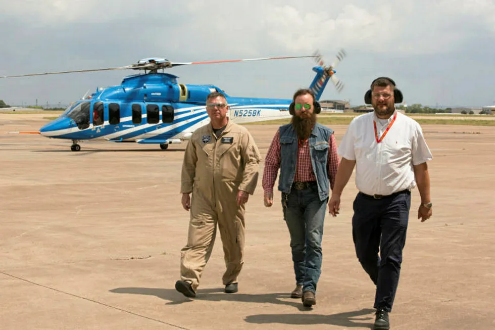 Texas test trip: Industri Energi's Henrik Fjeldsbo (centre) with helicopter committee member Torstein Sandven (right) and Bell technician, with Bell 525 in background