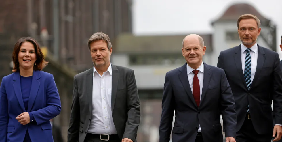From l to r: Green party leaders Annalena Baerbock and Robert Habeck, Germany's likely new Chancellor Olaf Scholz, and FDP leader Christian Lindner on way to present coalition treaty