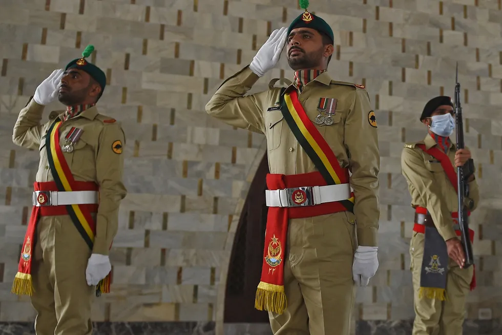 Three in line: ceremonial guards participate in a ceremony to mark Pakistan's National Day in Karachi in Pakistan on 23 March 2021