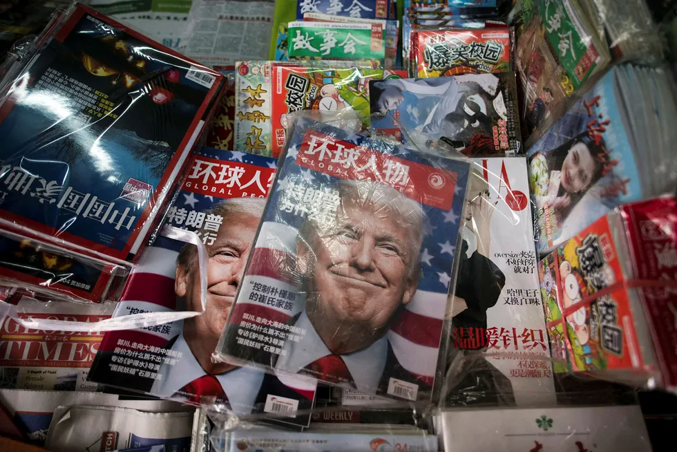 «Hvorfor vant Trump», spør det kinesiske tidsskriftet Global People på forsiden. Kina kan få økt innflytelse i den asiatiske delen av Stillehavsregionen under Donald Trump etter han trekker USA ut av handelssamarbeidet Trans-Pacific Partnership. Foto: Johannes Eisele/Afp/NTB Scanpix