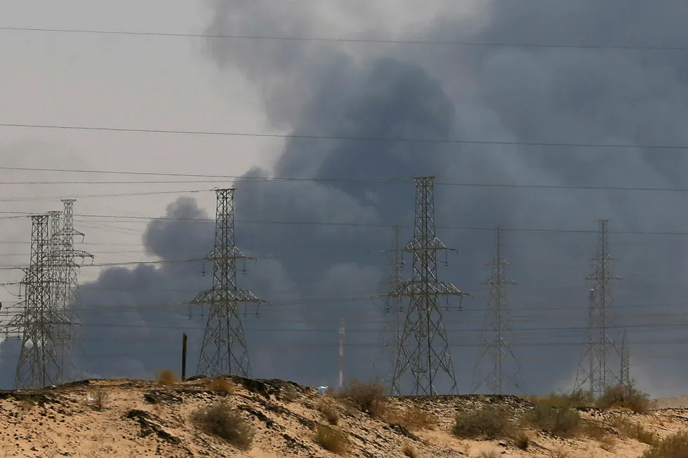 Smoke is seen following a fire at an Aramco factory in Abqaiq, Saudi Arabia, September 14, 2019