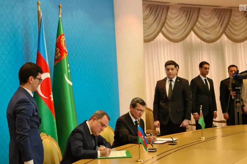 Peace talks: Azerbaijan Foreign Minister Dzheykhun Bayramov (left) and Turkmenistan Foreign Minister Rashid Meredov signing a memorandum on the Dostluk block in the Caspian Sea in Ashgabat on 21 January 2021