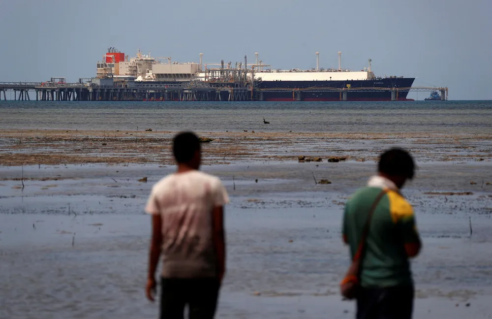 Future talks: a carrier docked at the marine facility of the ExxonMobil-operated LNG plant at Caution Bay