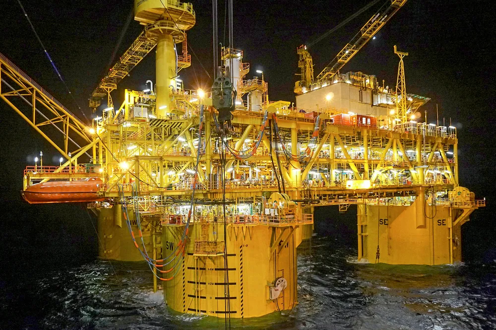 Producing asset: night view of the Malikai tension-leg platform