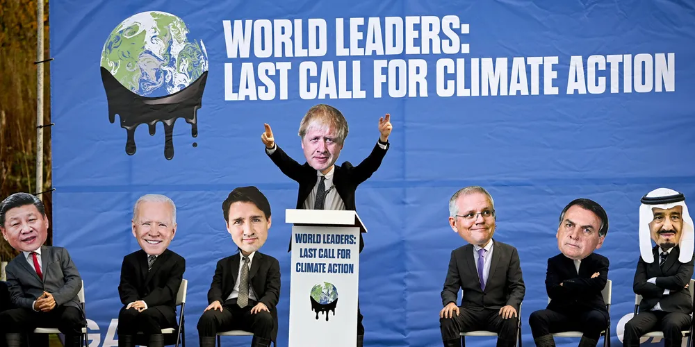 Activists dressed as world leaders in Glasgow, Scotland, for COP26.