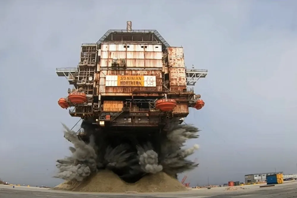 Boom: the dramatic moment the legs were blown off CNR International's Ninian North platform at the Dales Voe site in Shetland