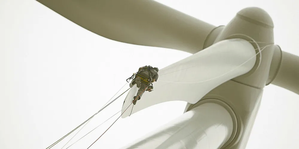 LM Wind Power service technician on the tip of a blade at the Brena wind farm in Spain