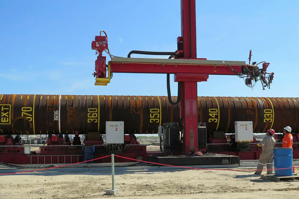 Workers make final preparations on a pile for the Pemex Ayatsil-C project in McDermott's fabrication yard in Altamira, Mexico