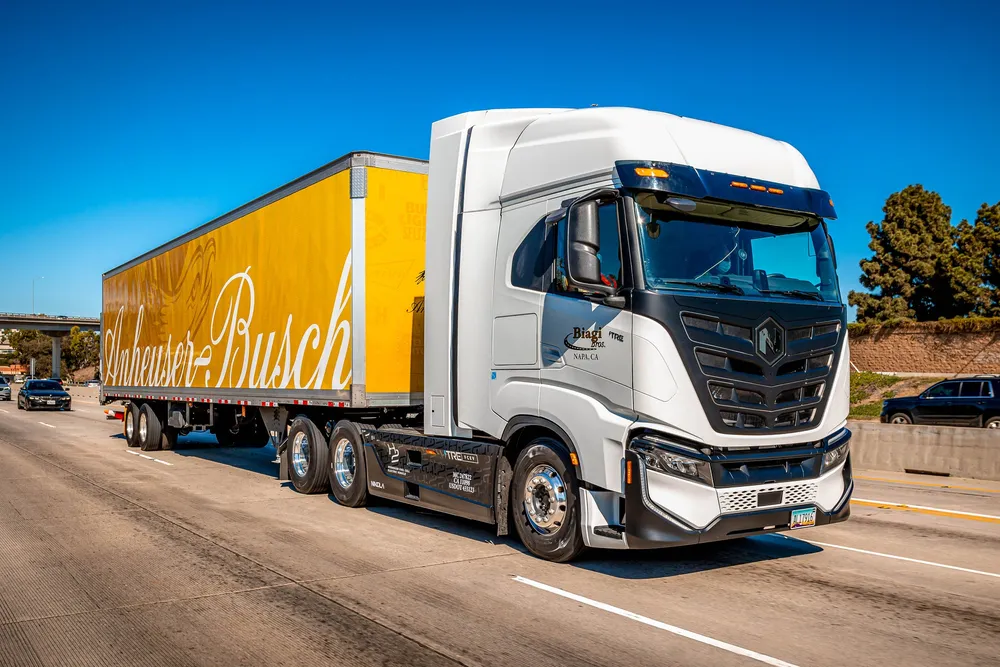 A Nikola Tre FCEV hydrogen-powered truck operating in the field.