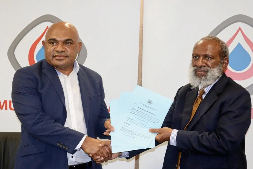 Ceremony: Kumul Petroleum's Wapu Sonk (left) and PNG Petroleum and Energy Minister Kerenga Kua (right)