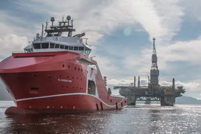 Forward motion: Njord A under tow to Kvaerner Stord