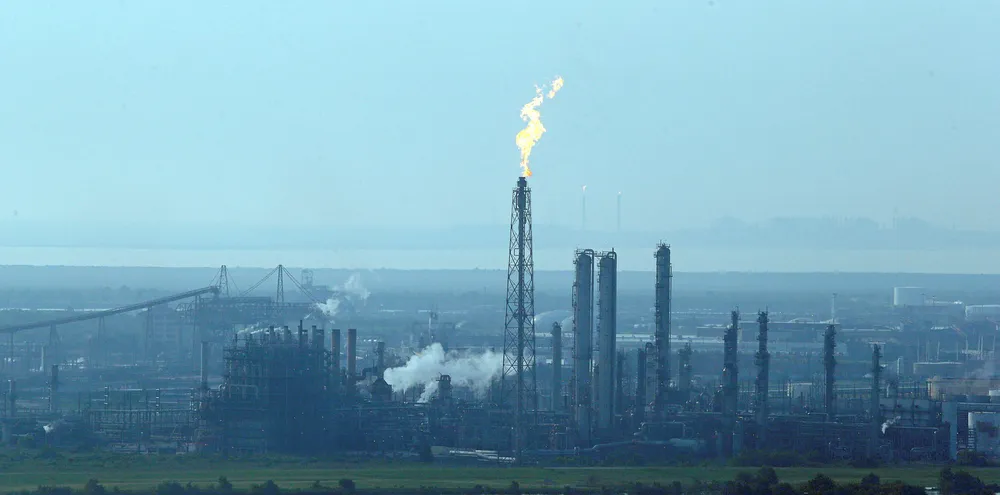 A flare stack puts out a flame at a refinery near Port Arthur, Texas