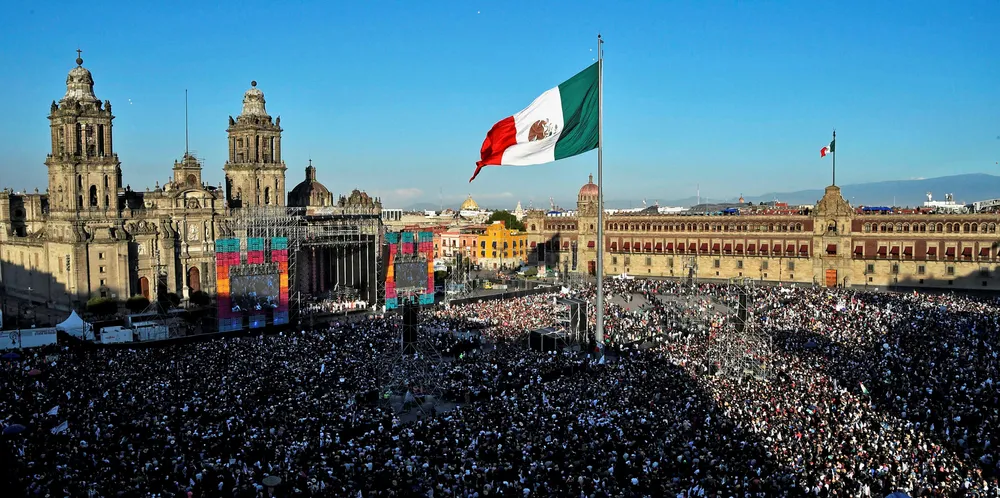 Supporters of Mexico's president Andres Manuel Lopez Obrador watch his inauguration ceremony.