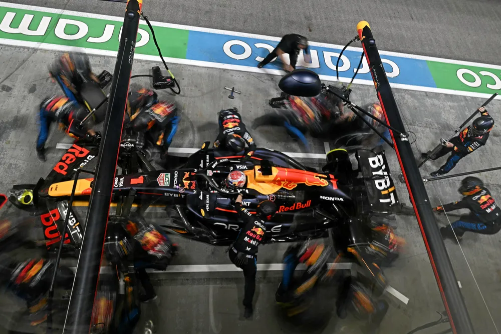 Team mechanics work on the car of Red Bull Racing's Dutch driver Max Verstappen in the pits during the Formula One Singapore Grand Prix.