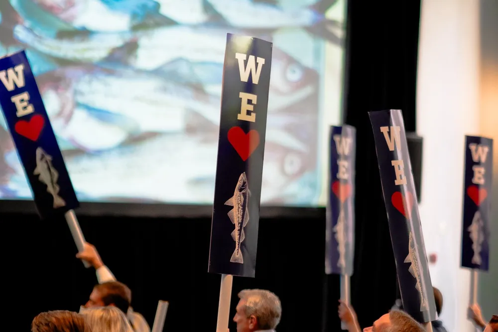 Attendees at the 2024 Genuine Alaska Pollock Producers annual meeting pollock show their support for US pollock sector.