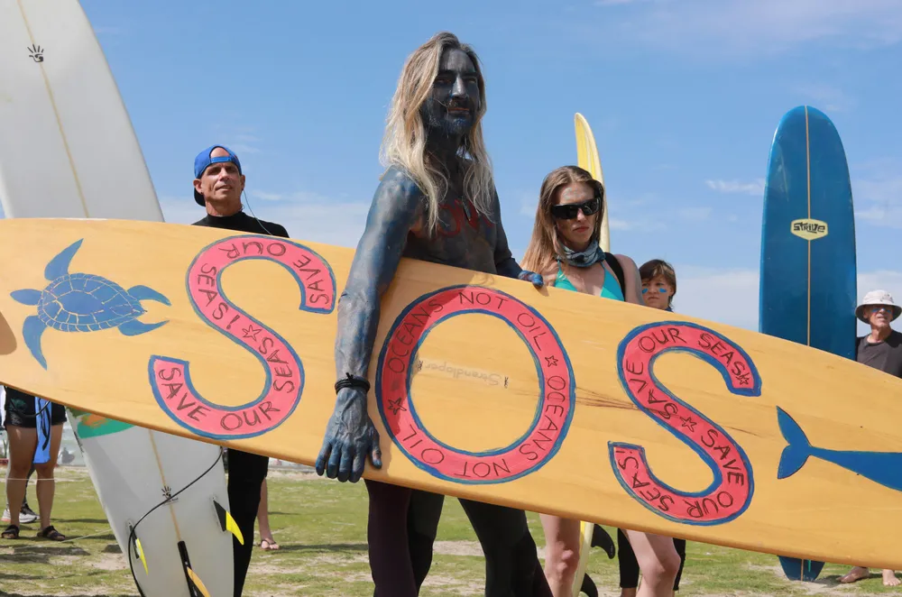 "Save Our Seas": surfers at Muizenberg beach in Cape Town, South Africa protest against seismic surveys off the country's western seaboard