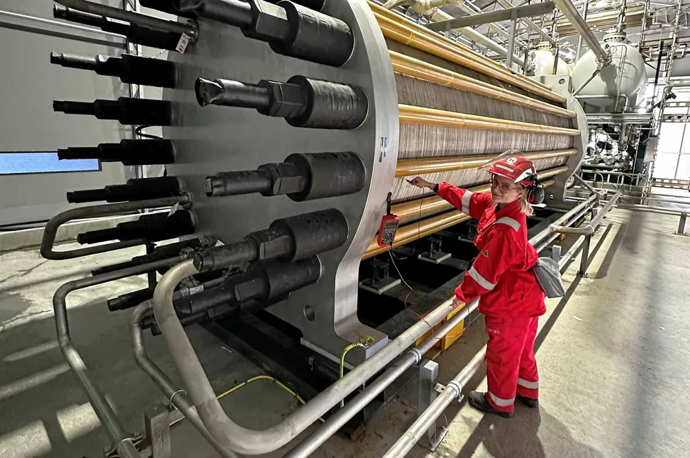 A HydrogenPro employee carries out an electrical test on one of the company's high-pressure alkaline electrolysers.