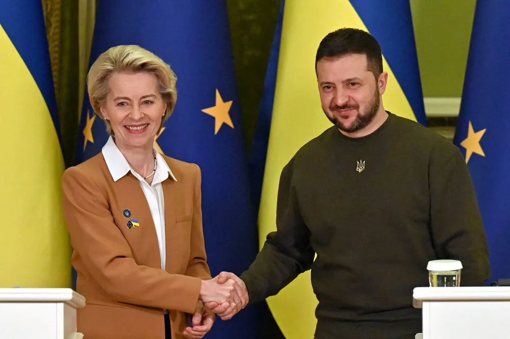 Ukrainian President Volodymyr Zelensky shakes hands with European Commission President Ursula von der Leyen in Kyiv on Thursday.