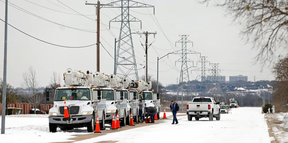 Electric service trucks line up after severe weather knocked out much of the Texas power grid last week.