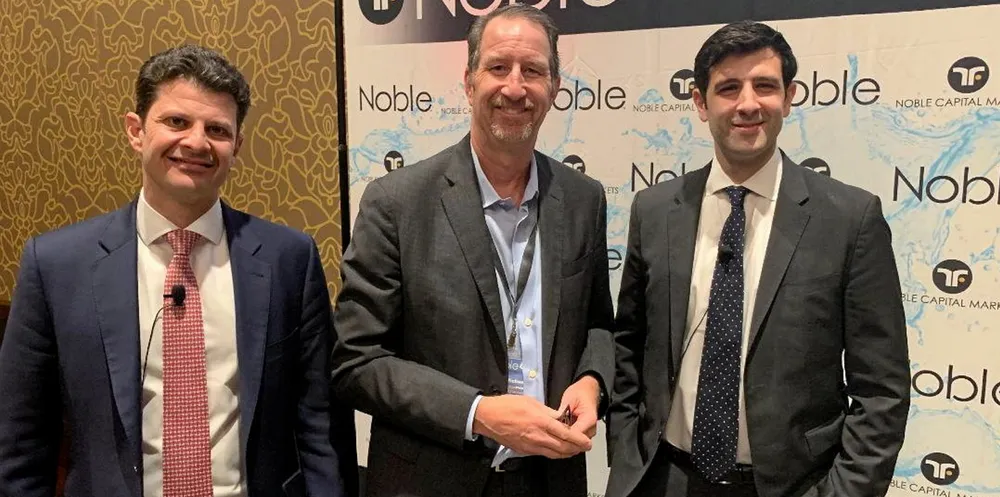 Noble Capital shipping analyst Michael Heim (centre) has taken down his numbers for dry bulk names for the third quarter. He is pictured at Noble's annual investor conference with Genco Shipping CFO Apostolos Zafolias and vice president Peter Allen.