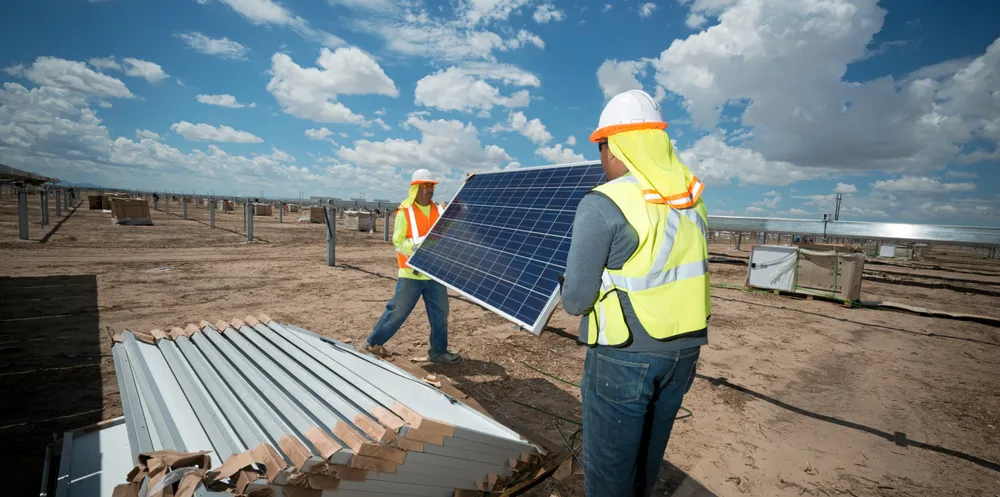 Installation workers with Swinerton, one of the largest solar EPC players in the US