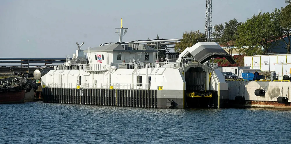 The feed barge has its own entrance and garage for boats at the stern.