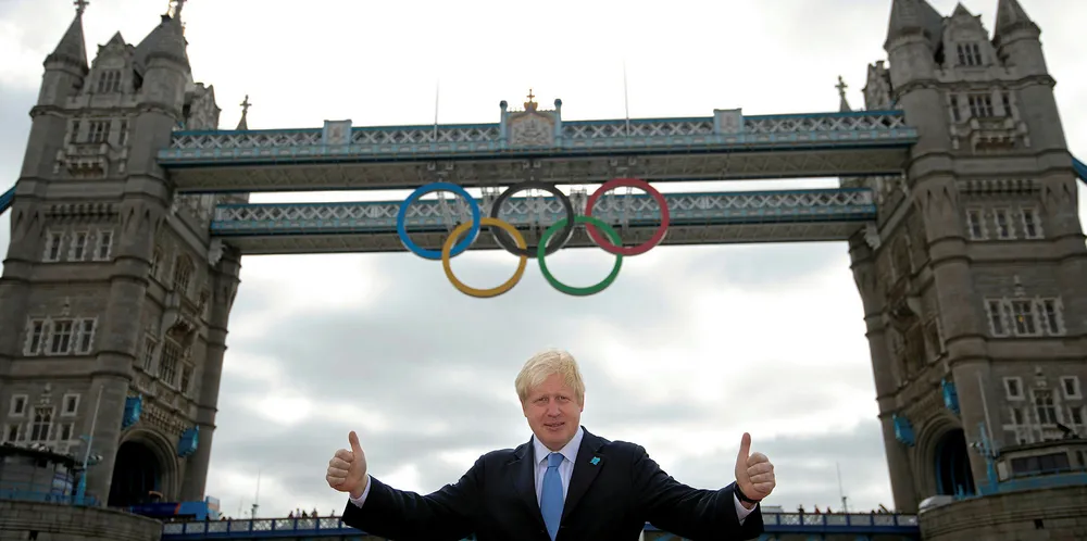 Boris Johnson poses for photographers during the unveiling of the 2012 Olympic rings on Tower Bridge in east London.