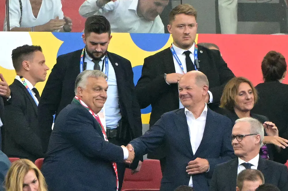 Hungary’s Prime Minister Viktor Orban (left) shakes hands with German Chancellor Olaf Scholz (right) after Wednesday’s UEFA Euro 2024 football match between Germany and Hungary in Stuttgart.