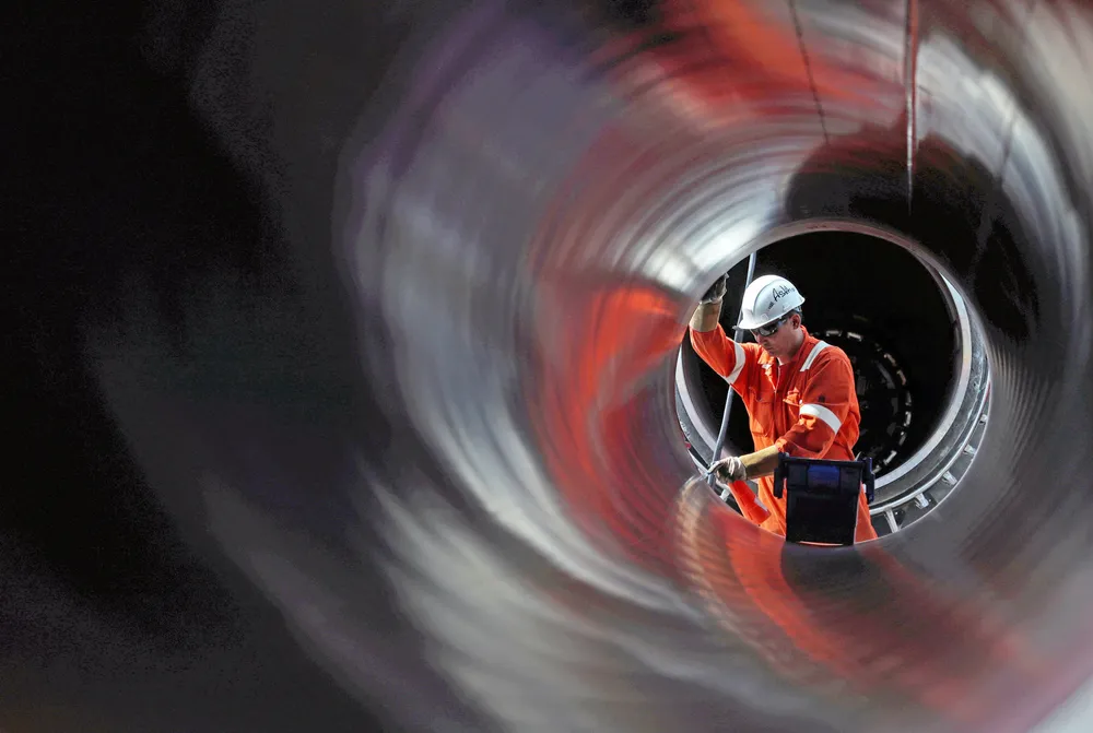 Test failed: A worker examines a pipe at a Nord Stream 2 construction site near the Russian town of Kingisepp in June 2019