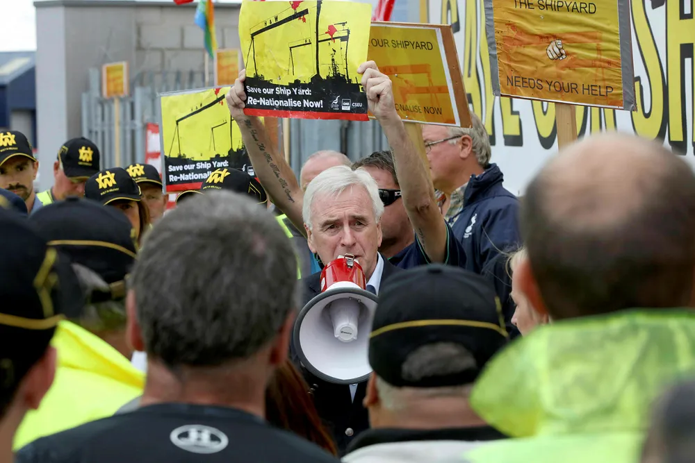 Demonstration: Labour Party shadow chancellor John McDonnell speaks to Harland and Wolff workers protesting for the shipyard to be saved in Belfast on Monday