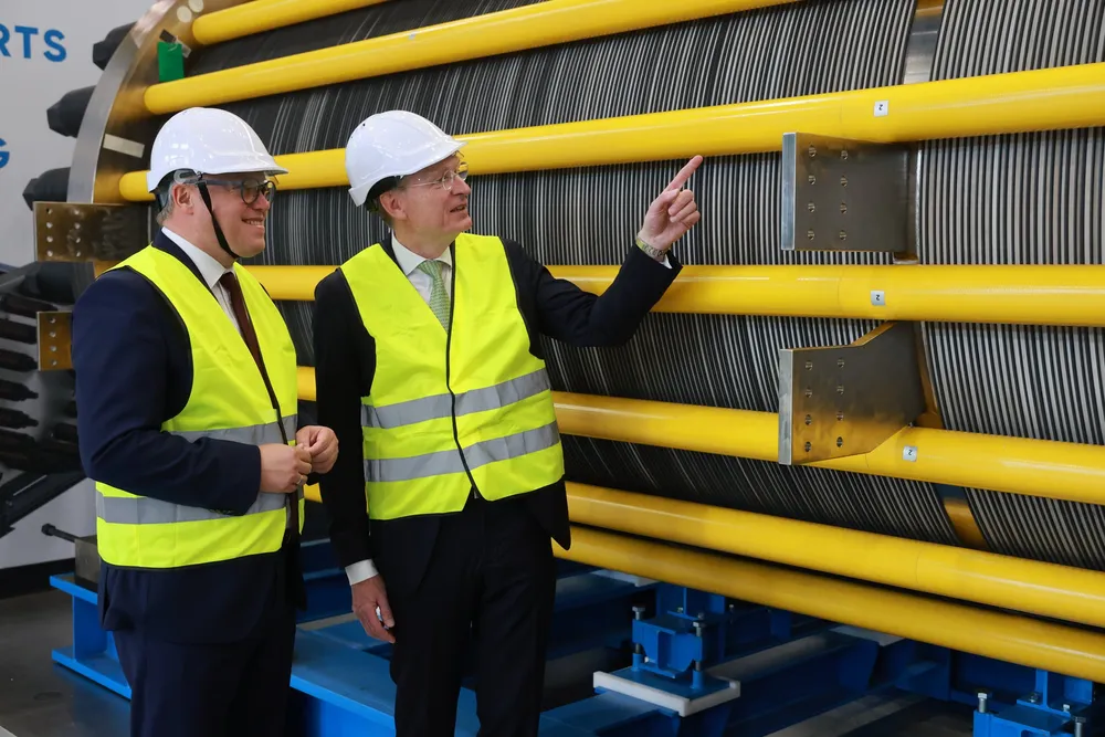 Andritz CEO Joachim Schönbeck, right, showing one of the new electrolyser stacks to Mario Voigt, prime minister of the state of Thuringia, where the Erfurt factory is situated.