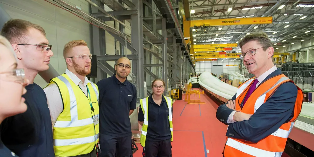 UK business secretary Greg Clark talks to employees at the Siemens Gamesa blade plant in Hull, northeast England