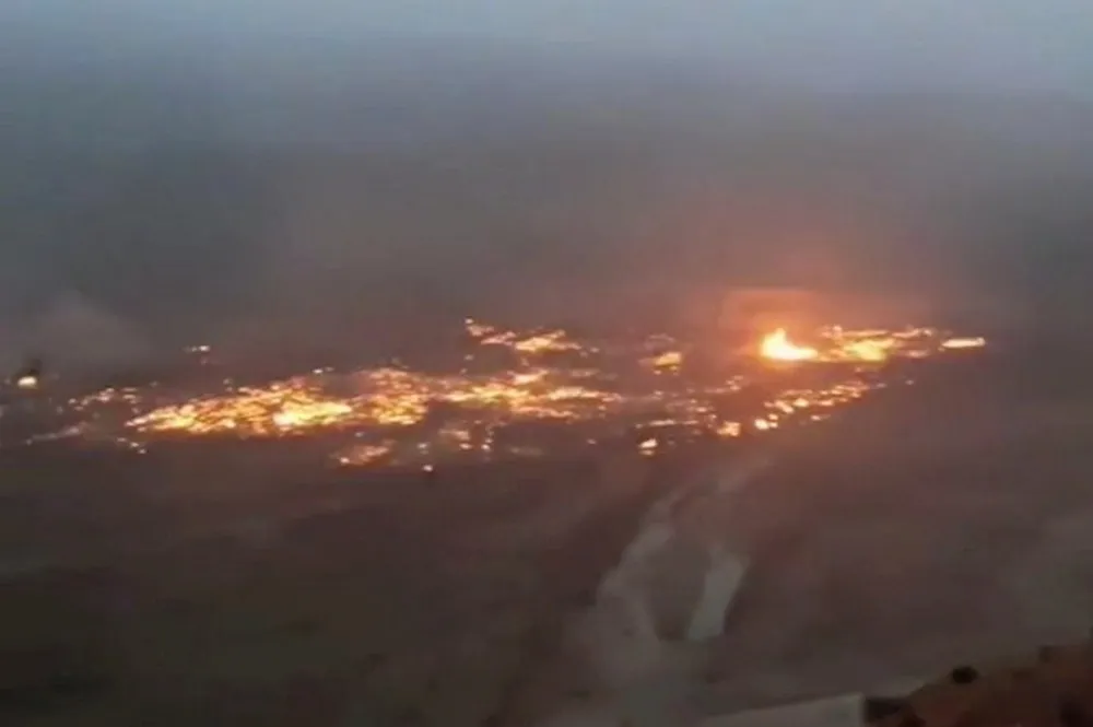 Gas burning on the ground at the M-25 field in Uzbekistan.