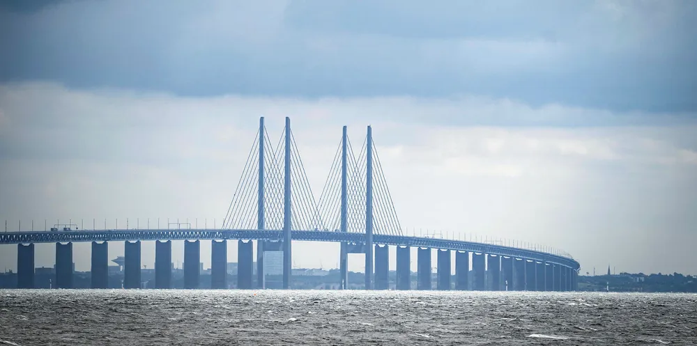 A picture taken on June 30, 2020 in Copenhagen, shows a view of the Oresund Bridge, which connects Denmark and Sweden. The 20th anniversary of the bridge was marked on July 1, 2020.