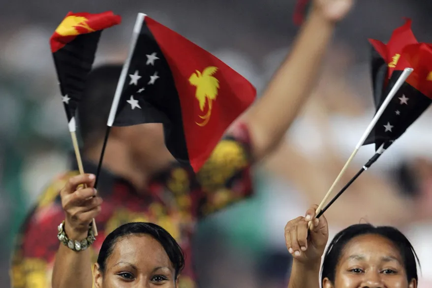 Teaming up in PNG: a delegation from the country wave the national flag at the opening ceremony of the Beijing Olympics