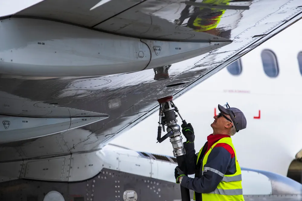 An airplane being filled with conventional jet fuel.