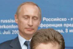 Landmark deal: Gazprom executive chairman Alexei Miller with Russian President Vladimir Putin (rear)