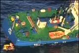 Going down: crew abandon the listing Jork after it collided with an unmanned gas platform in the North Sea in August