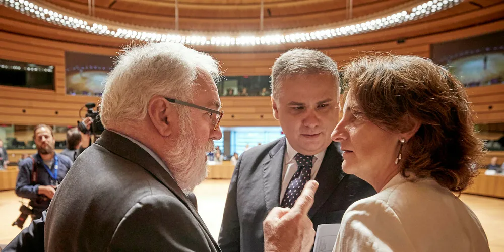 EU climate and energy commissioner Miguel Arias Canete talks with Jorge Seguro Sanches, Portuguese secretary of state for energy, and Teresa Ribera, Spanish minister for Ecological Transition, during negotiations over the target.