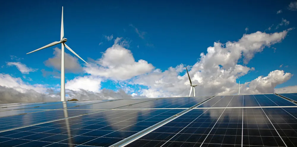 Wind turbines and solar panels.