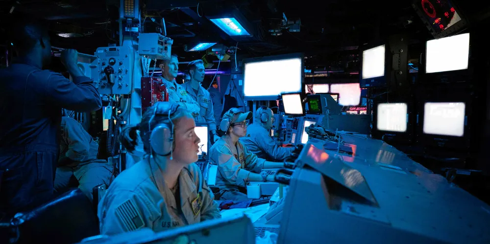 Sailors on a US destroyer are seen during an operation against Houthi missiles.