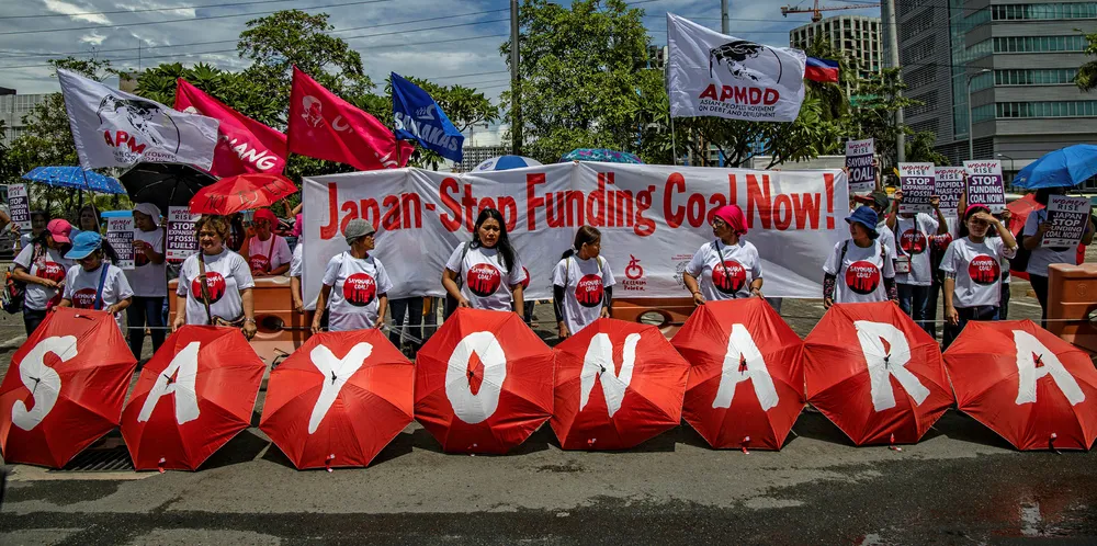Environmental activists take part in a protest calling on the Group of 20 nations (G20) to end funding for coal and fossil fuels, outside the Embassy of Japan in June 2019.
