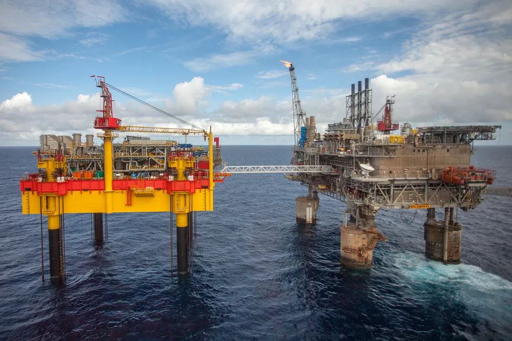 Linked in: Phase 3 of the Malampaya project in the Philippines includes a new depletion compression platform, at left, linked by bridge to the existing shallow-water platform