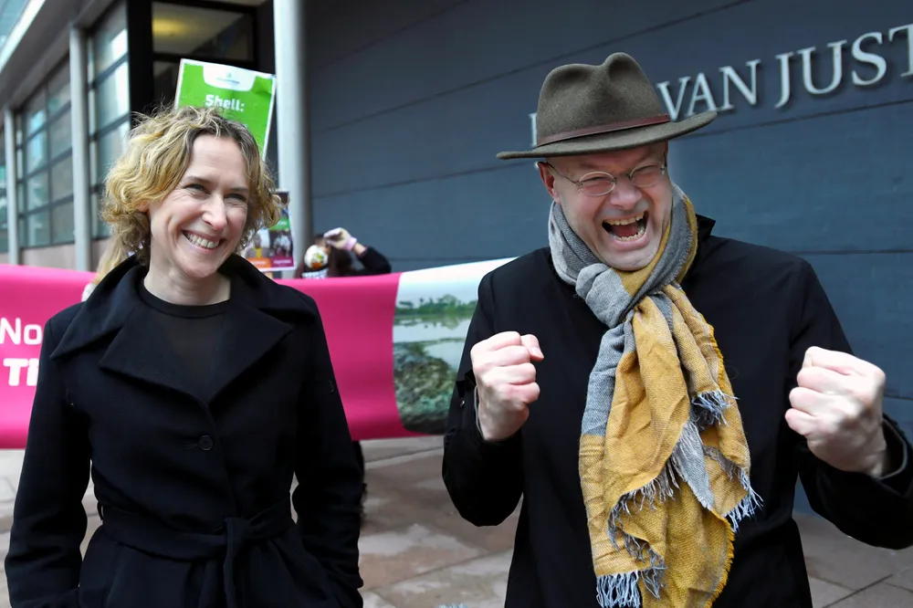 Delighted: Donald Pols (right), director of Friends of the Earth Netherlands, and lawyer Channa Samkalden react as they leave the appeals court The Hague, Netherlands