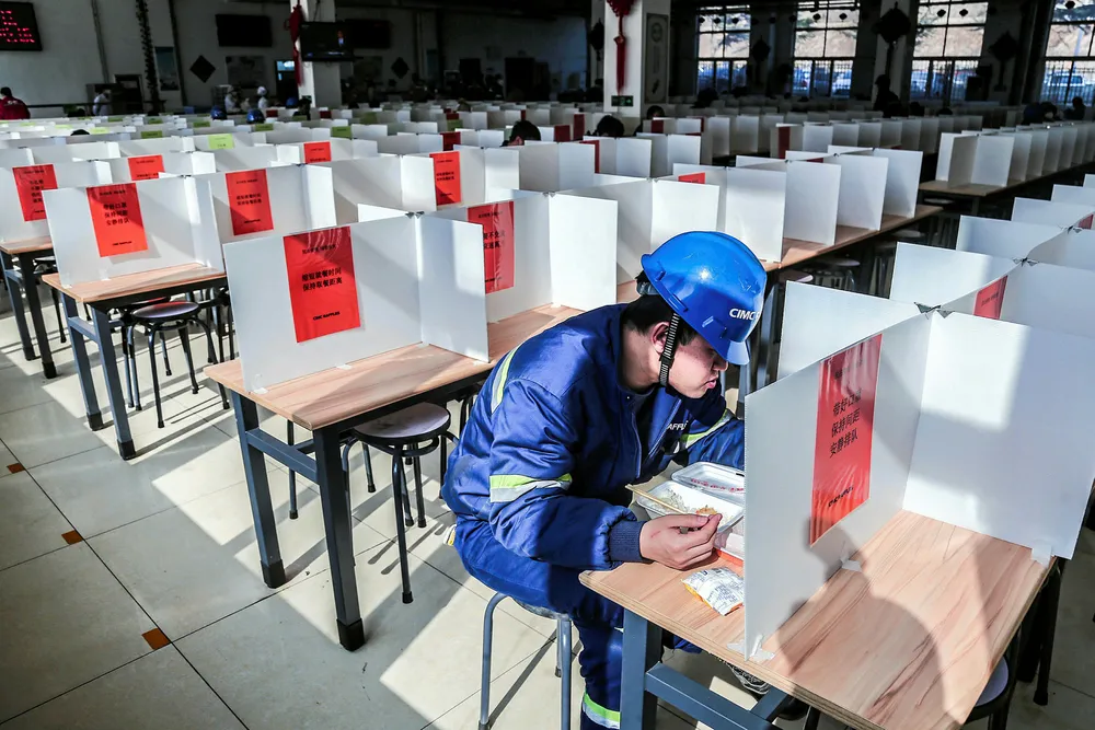 Fewer new cases: Partitioned dining tables at the CIMC Raffles canteen, which the Chinese yard introduced to help prevent workers from contracting coronavirus